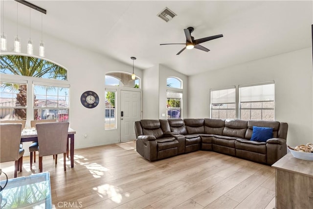 living room with ceiling fan and light wood-type flooring