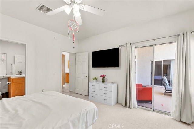 bedroom with visible vents, a ceiling fan, light colored carpet, access to outside, and a sink