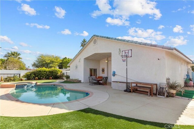 view of pool with outdoor dining area, a patio area, and a pool with connected hot tub