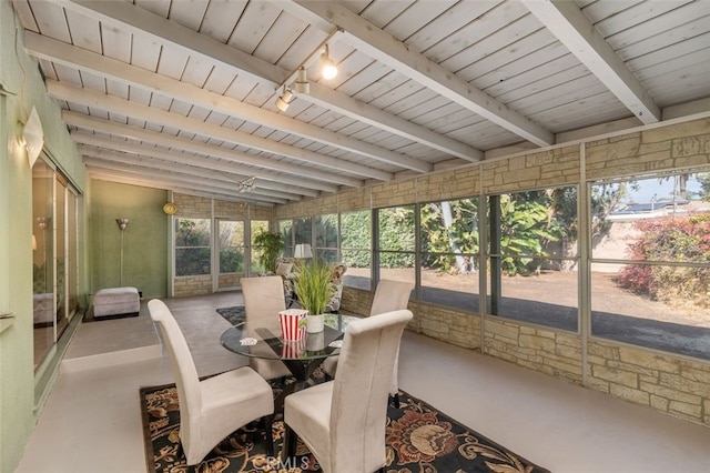 sunroom with wooden ceiling, rail lighting, and beamed ceiling