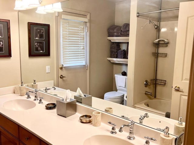 full bathroom featuring vanity, tub / shower combination, and toilet