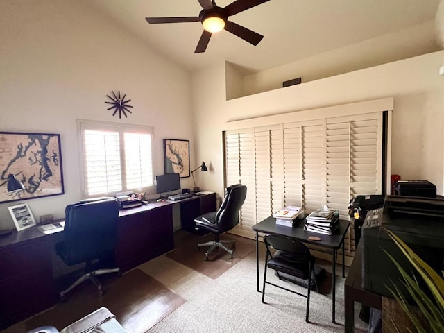 office with high vaulted ceiling, ceiling fan, and carpet