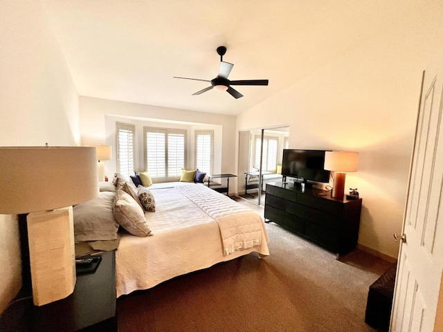 bedroom with vaulted ceiling, carpet, and ceiling fan