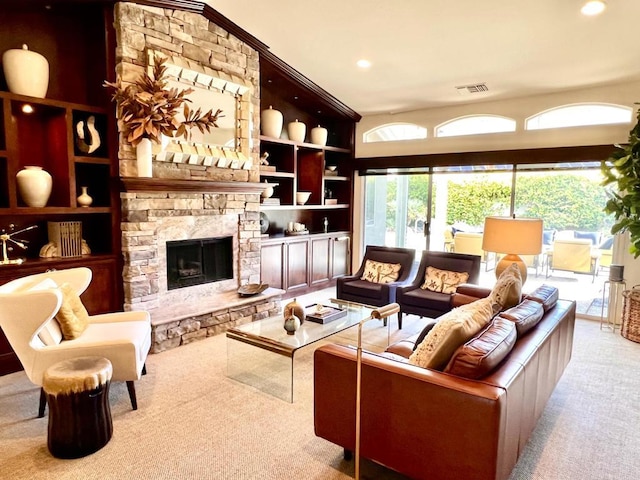 carpeted living room featuring built in shelves and a fireplace