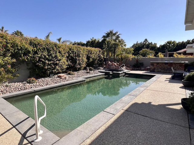 view of swimming pool with a patio