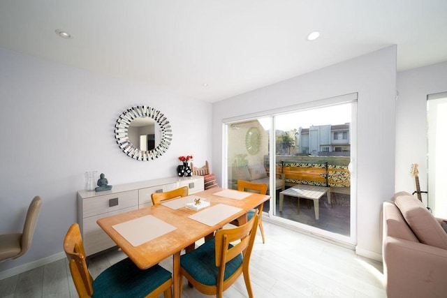 dining area with light hardwood / wood-style floors