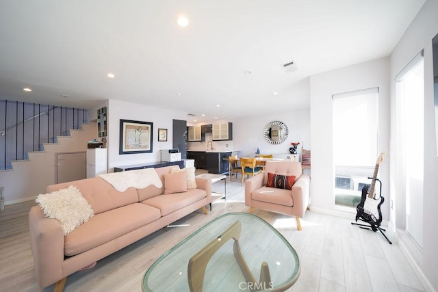 living room with light hardwood / wood-style flooring