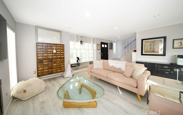 living room with mail boxes and light wood-type flooring