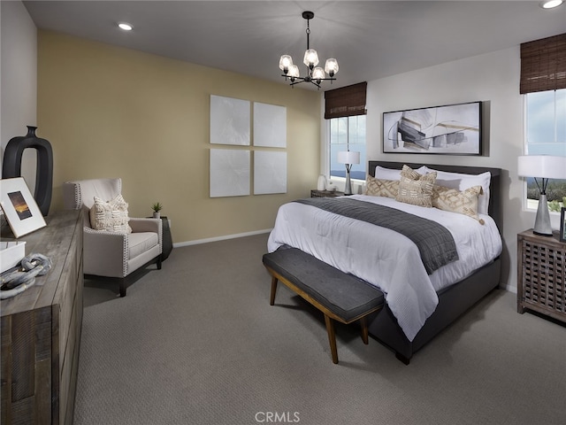 carpeted bedroom with a chandelier