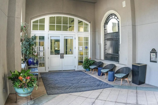 view of exterior entry featuring french doors