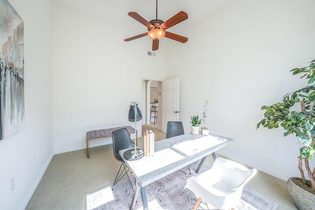 carpeted office featuring high vaulted ceiling and ceiling fan