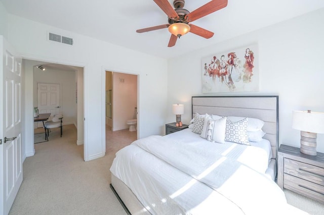 carpeted bedroom featuring ensuite bathroom and ceiling fan