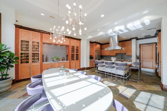 dining area with an inviting chandelier