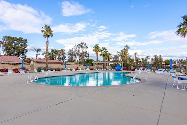 view of swimming pool with a patio area