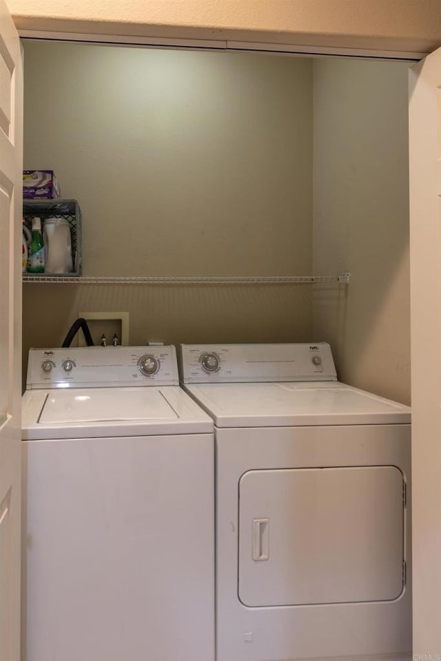 laundry room featuring separate washer and dryer