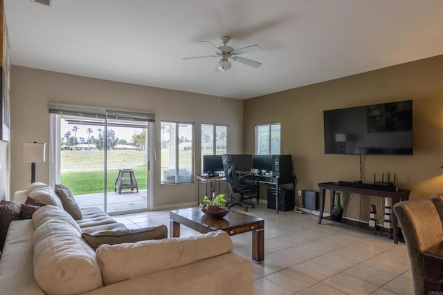 tiled living room with ceiling fan