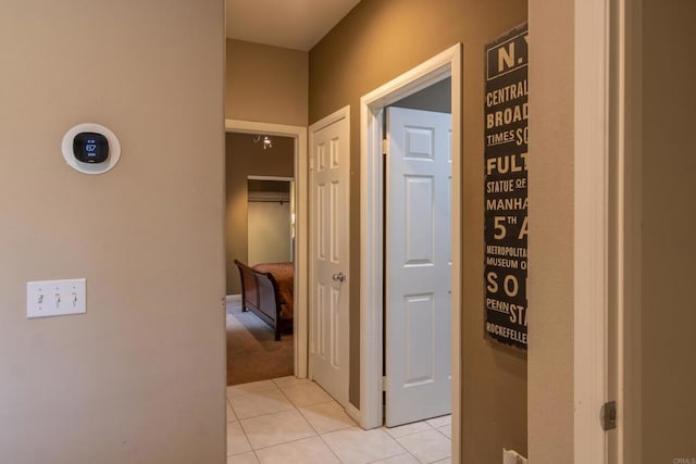 hall featuring light tile patterned flooring