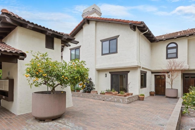 rear view of house featuring a patio