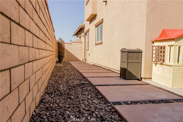 view of side of property with a patio