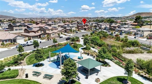 birds eye view of property with a mountain view