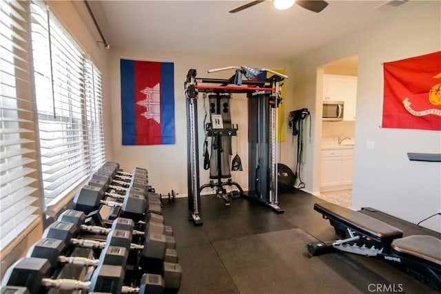 workout area featuring ceiling fan