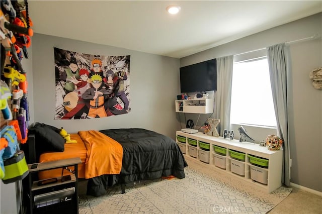 bedroom featuring light colored carpet