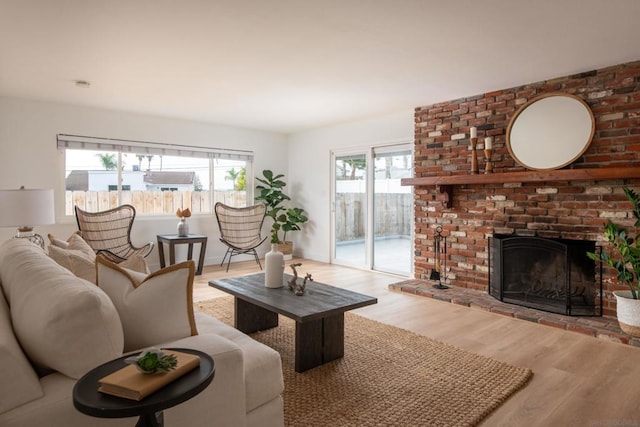 living room featuring a fireplace and light hardwood / wood-style floors