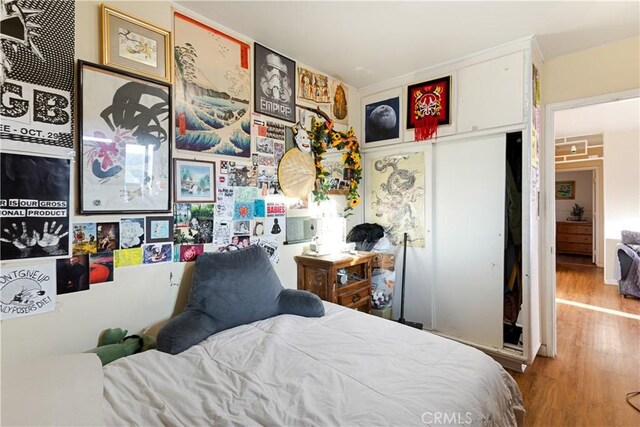 bedroom with hardwood / wood-style flooring