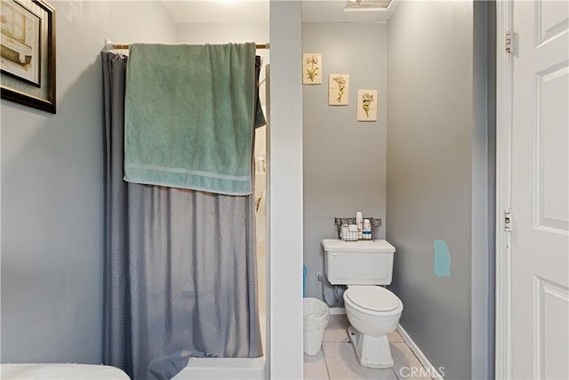 bathroom featuring tile patterned floors and toilet