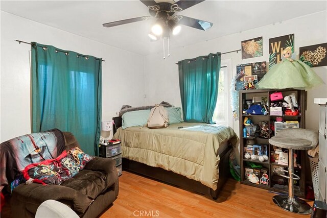 bedroom featuring ceiling fan and wood-type flooring