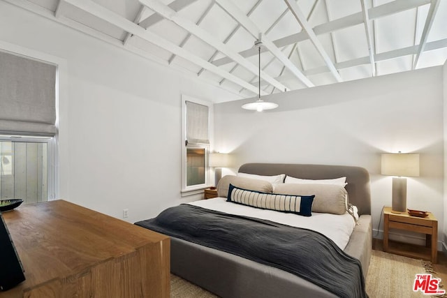 bedroom with beam ceiling