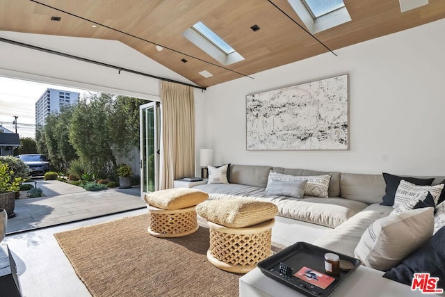 living room featuring lofted ceiling with skylight and wooden ceiling