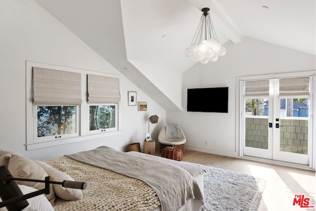 bedroom featuring multiple windows, access to exterior, a notable chandelier, and lofted ceiling with beams