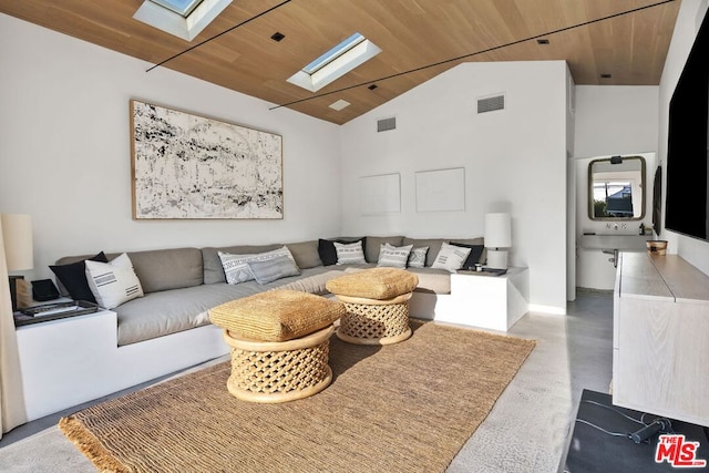 living room with lofted ceiling with skylight and wood ceiling