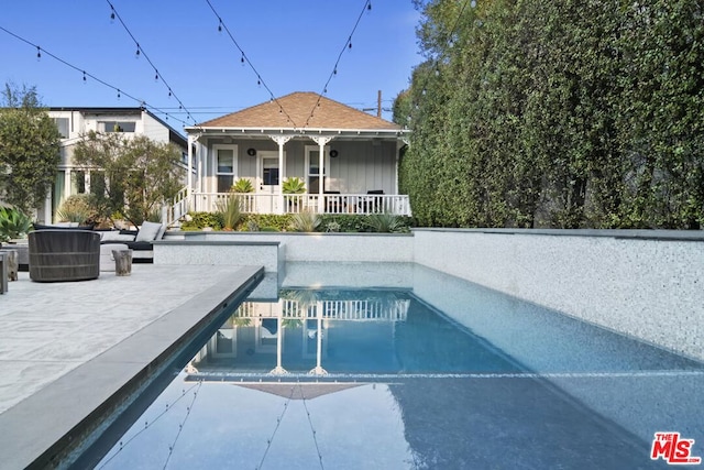 view of pool featuring a patio