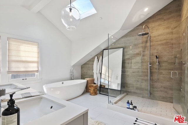 bathroom with vanity, lofted ceiling with skylight, separate shower and tub, and tile patterned flooring