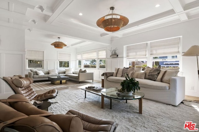 living room featuring coffered ceiling and beam ceiling