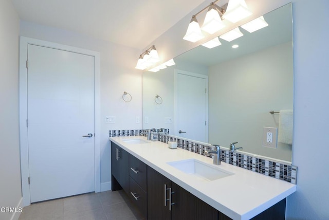 bathroom featuring tile patterned flooring and vanity