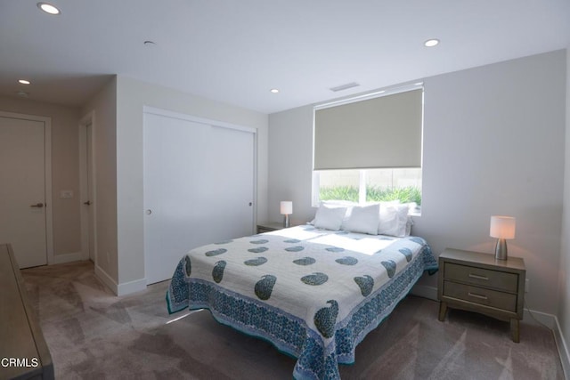 carpeted bedroom with a closet