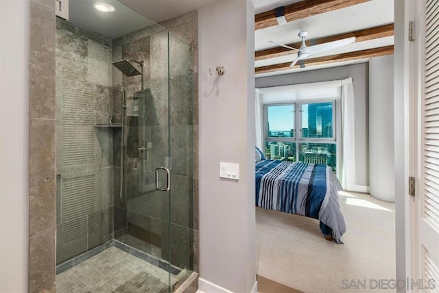 bathroom with beamed ceiling, ceiling fan, and walk in shower