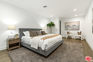 bedroom featuring dark hardwood / wood-style flooring