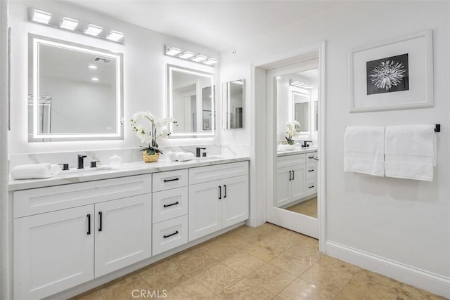 bathroom with tile patterned flooring and vanity