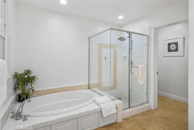 bathroom featuring tile patterned flooring and plus walk in shower