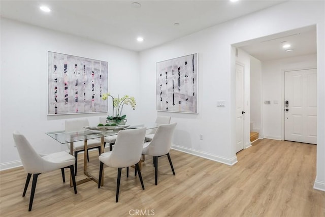 dining area featuring light wood-type flooring