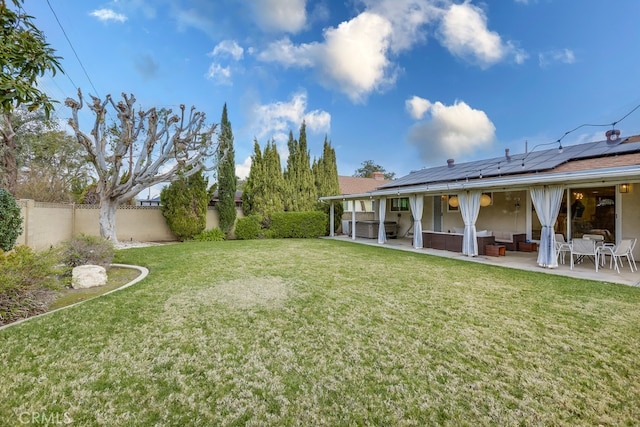 view of yard with an outdoor living space and a patio area