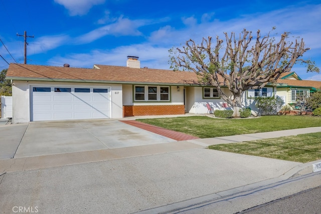 single story home with a garage and a front yard