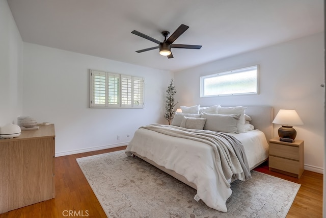 bedroom featuring ceiling fan and wood-type flooring