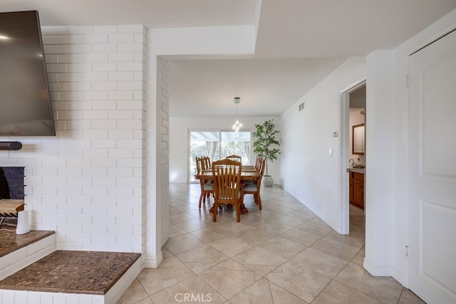 dining area with light tile patterned floors