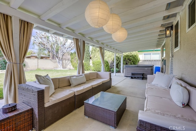 view of patio with a hot tub and outdoor lounge area