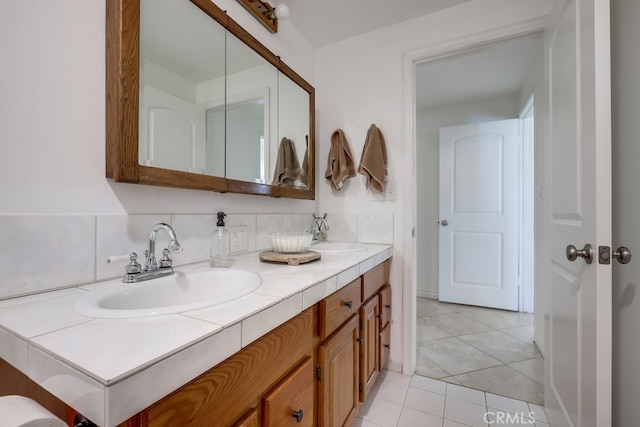 bathroom featuring tile patterned flooring and vanity